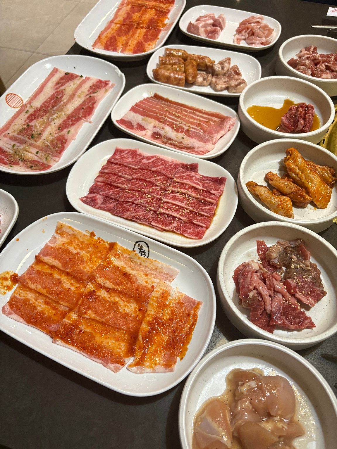 Full table spread of meats and sides at Gyubee Merivale